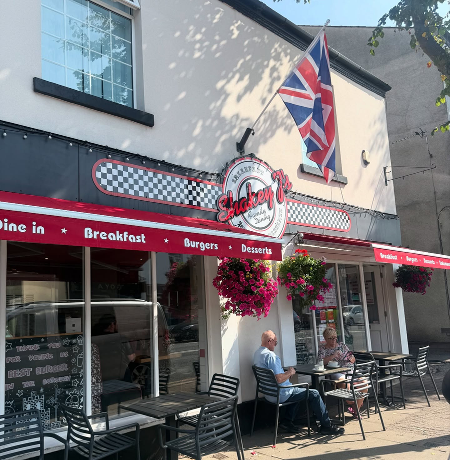 Shakey J's storefront with outdoor seating on the High Street